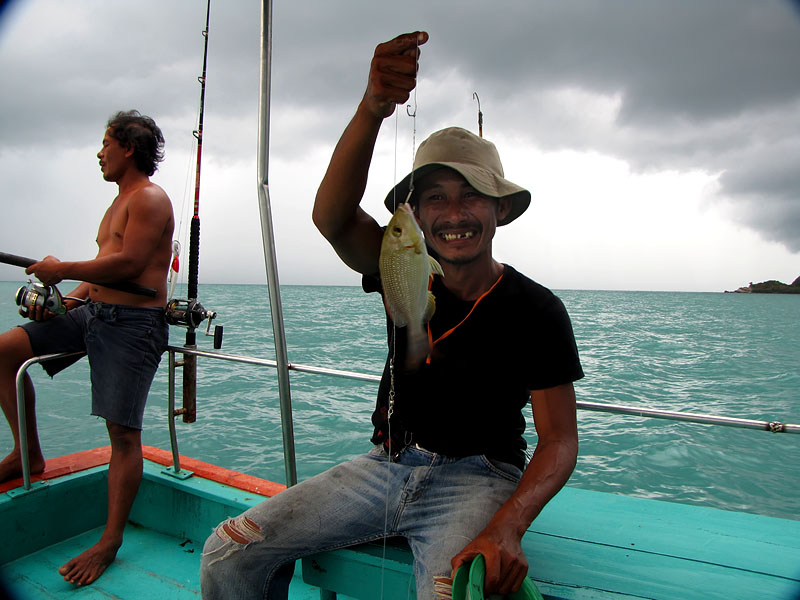 Веселый тайский рыбак